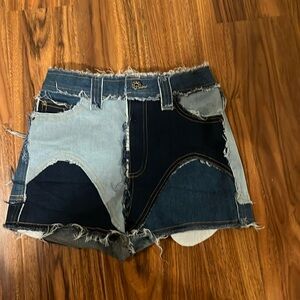 Distressed patchwork jean shorts